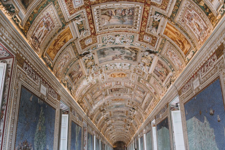 Explore the detailed fresco ceilings of Vatican Museum's breathtaking halls.